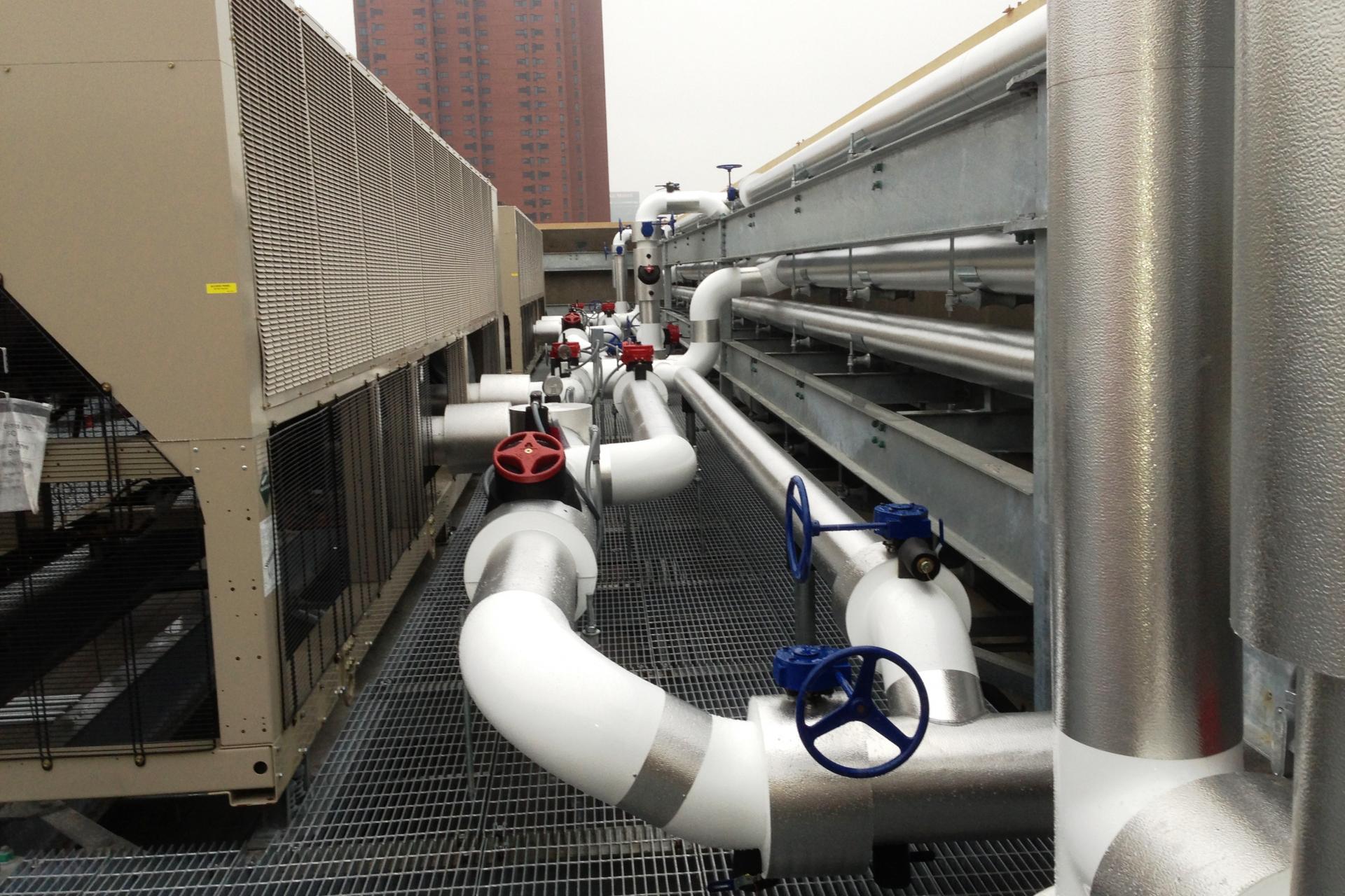 Jacketed chilled water pipe includes redundant valves and capped spares for future expansion equipment.